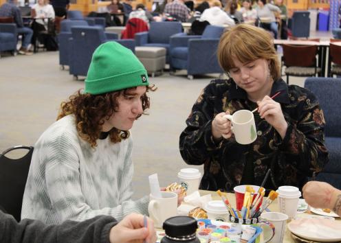 Students paint their ceramic pieces