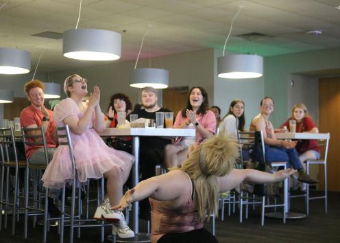 Participants cheer on drag performer MasQueLeen 