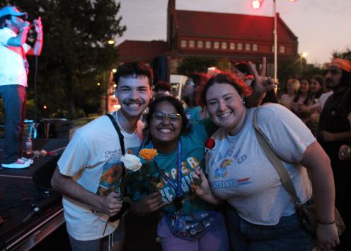 Participants pose with flowers at the event 