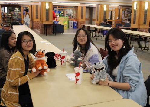 Participants pose with their stuffed animals
