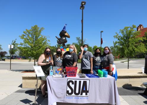 SUA members at the SUA table during the celebration of Union 100
